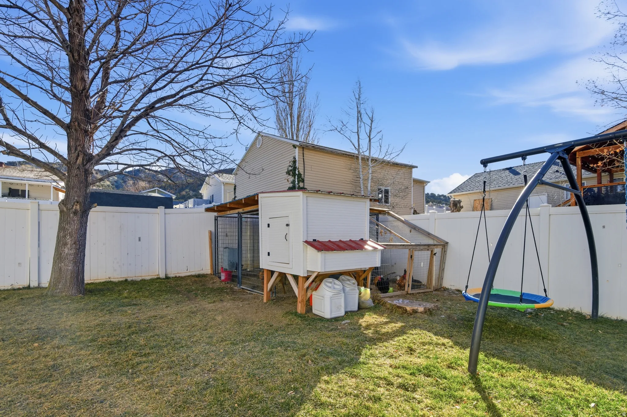 Fenced backyard with exterior structure and an outdoor structure