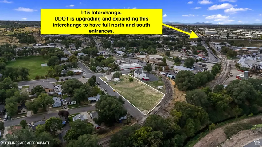 Aerial view of property and surrounding area featuring property boundaries highlighted