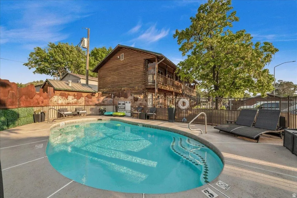 Community pool featuring a patio area