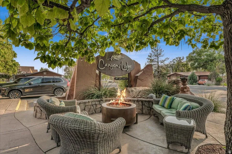 View of patio with an outdoor living space with a fire pit