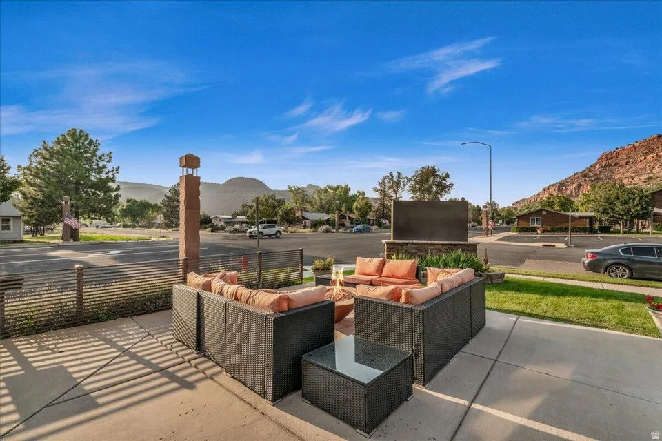 View of patio with a mountain view and an outdoor living space