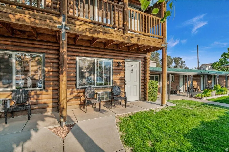 Patio / terrace with a lawn