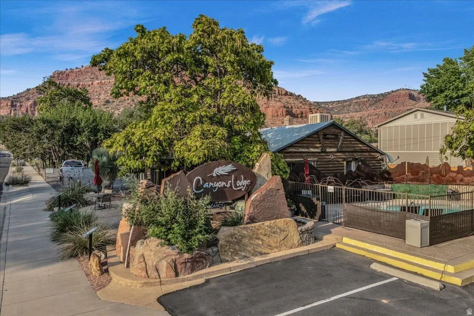 View of community featuring a mountain view and uncovered parking