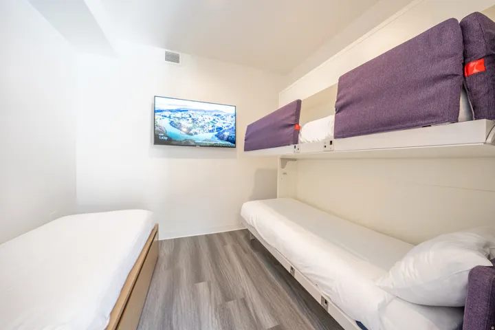 Bedroom featuring light wood-style floors and baseboards