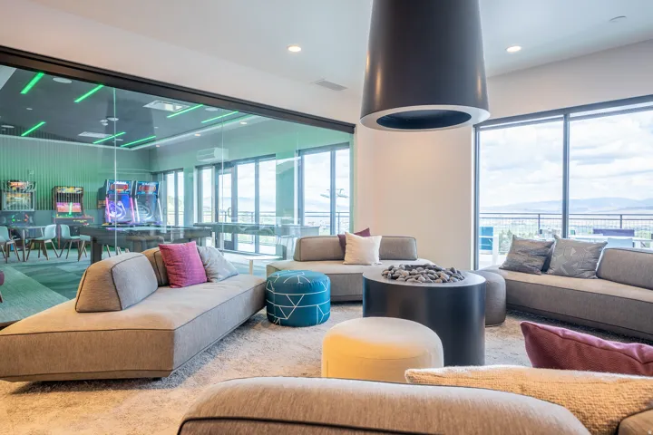 Carpeted living room with recessed lighting