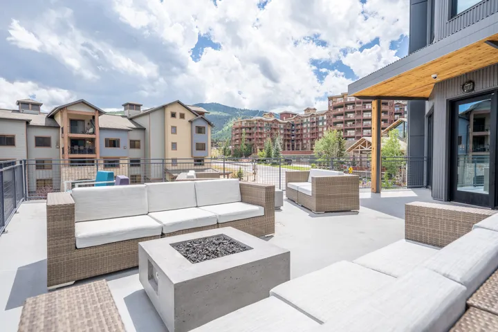 View of patio / terrace with an outdoor living space with a fire pit and a mountain view