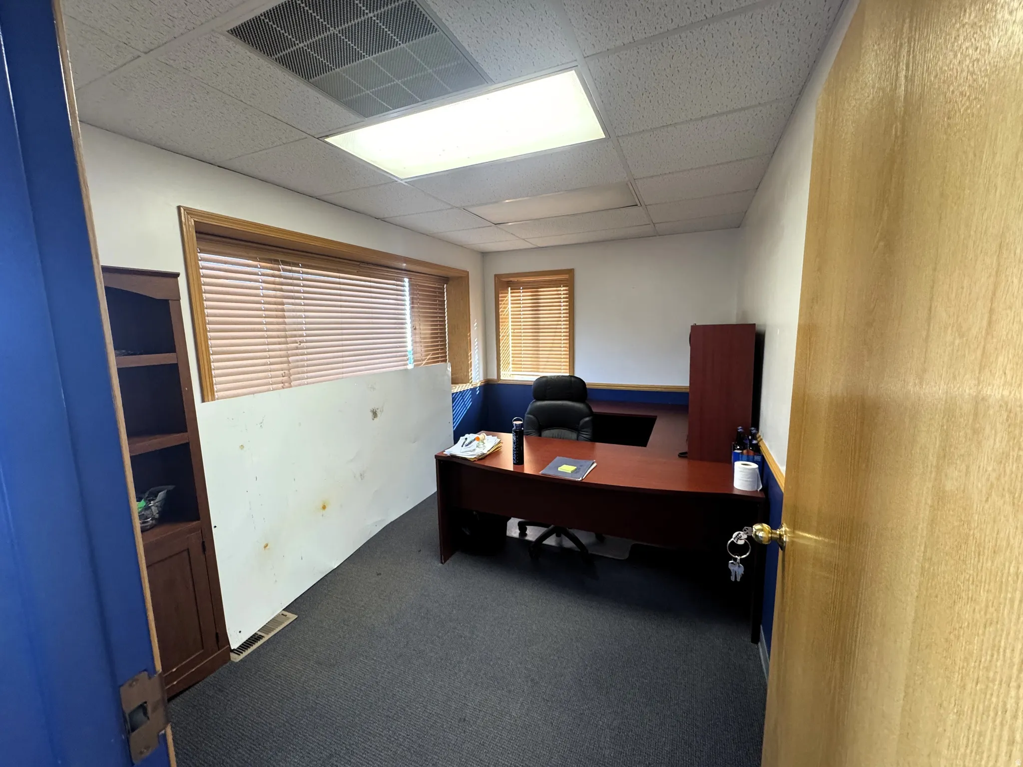 Office space featuring a paneled ceiling