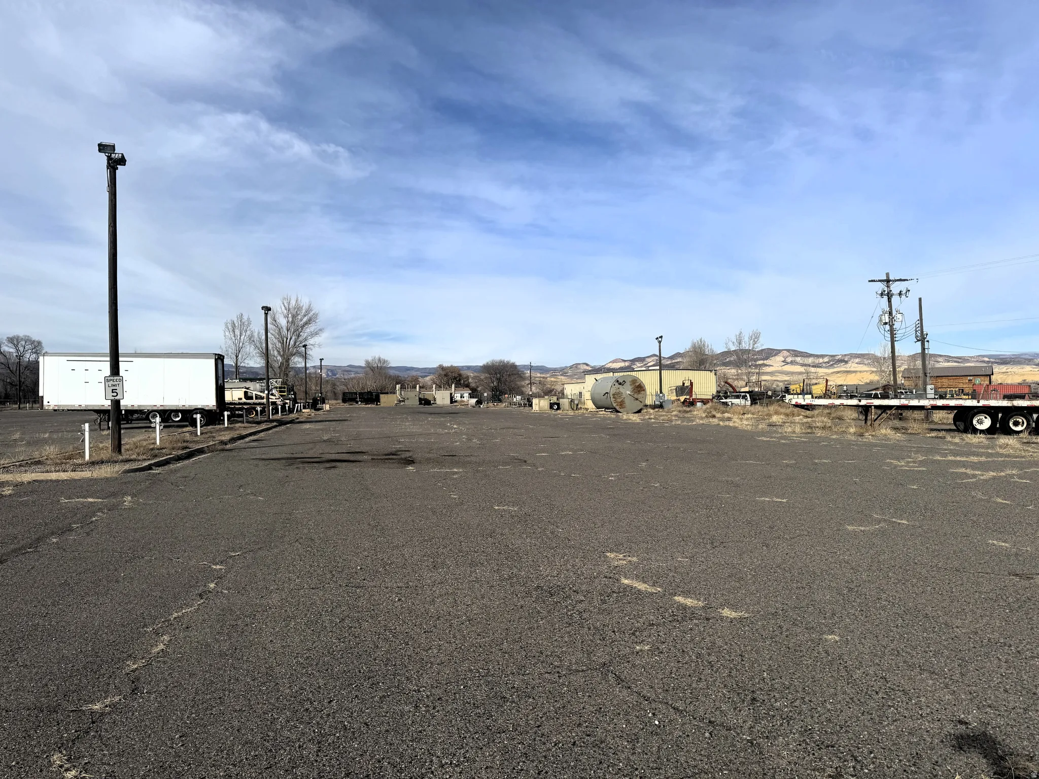 View of asphalt street with street lights