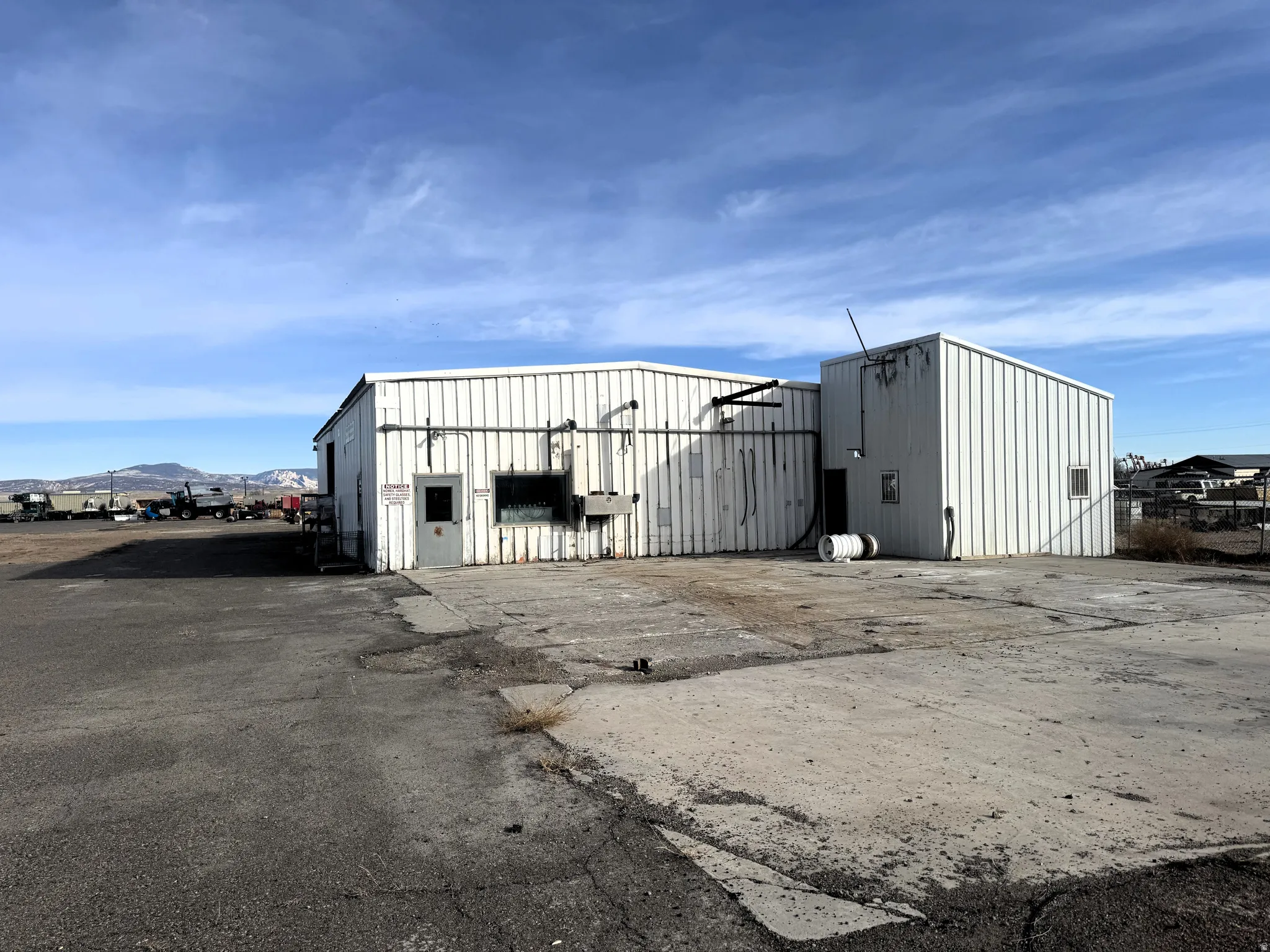 View of pole building with a mountain view