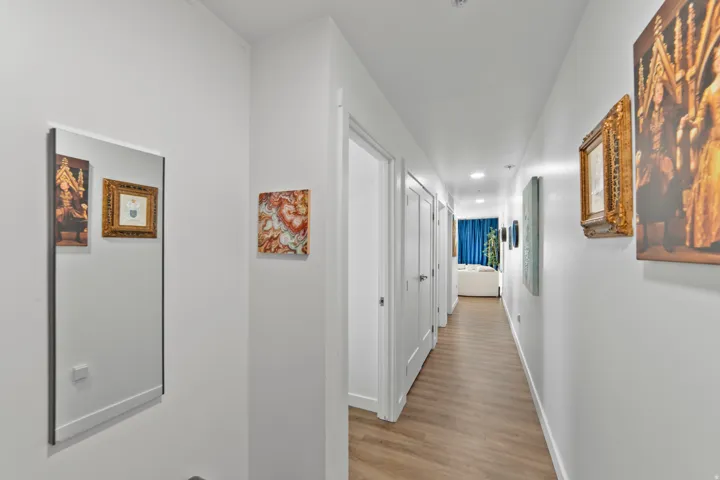 Hallway featuring recessed lighting and light wood-style floors