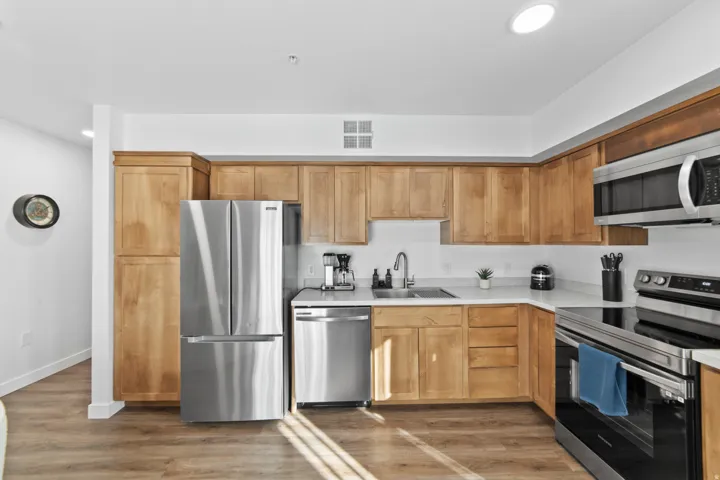 Kitchen featuring stainless steel appliances, light wood-type flooring, and recessed lighting