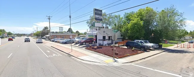 View of asphalt street with sidewalks and curbs