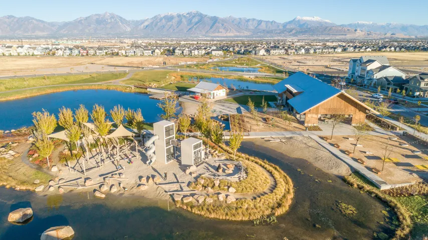 Aerial perspective of suburban area featuring a water and mountain view