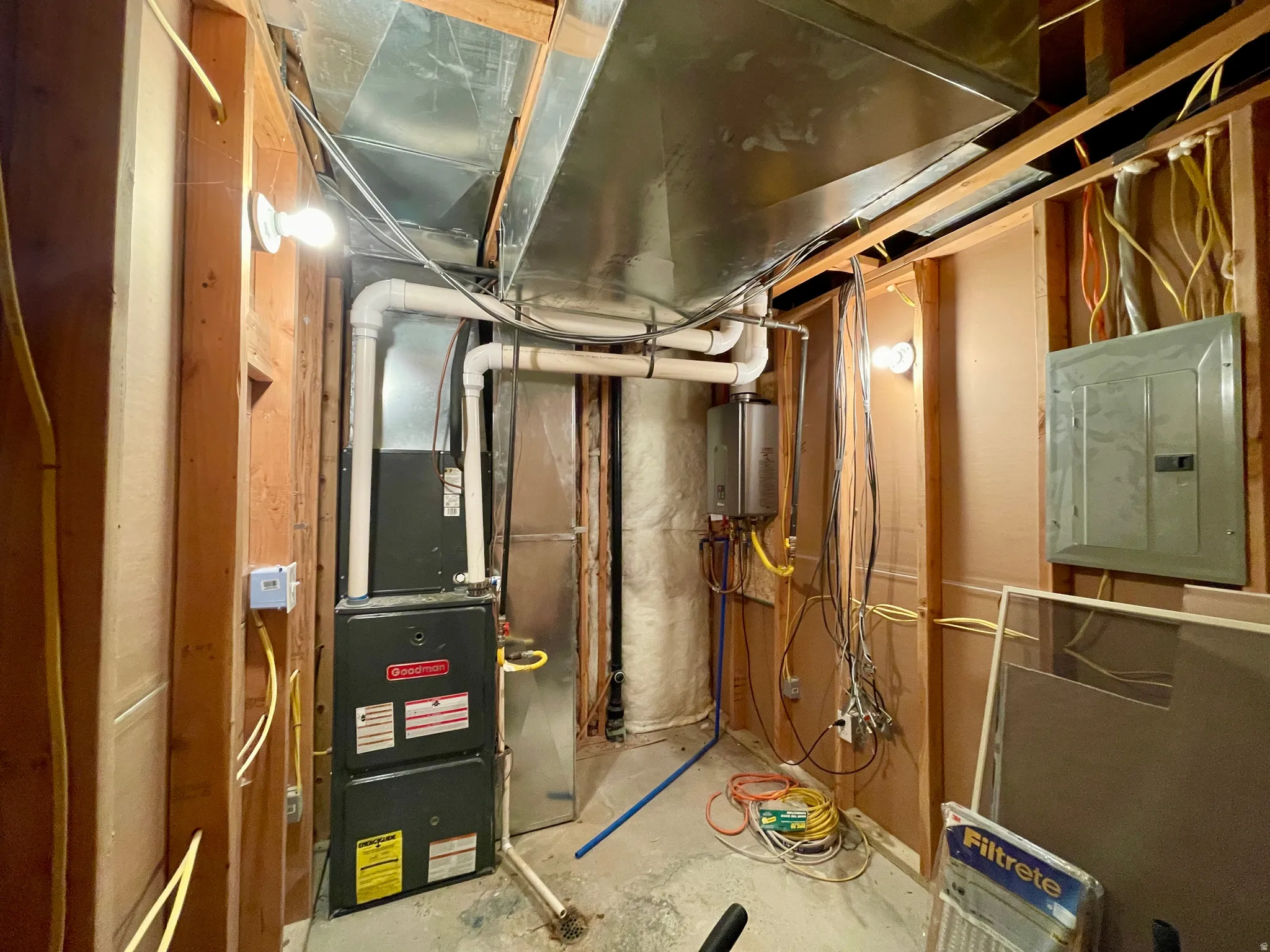 Utilities featuring electric panel and water heater