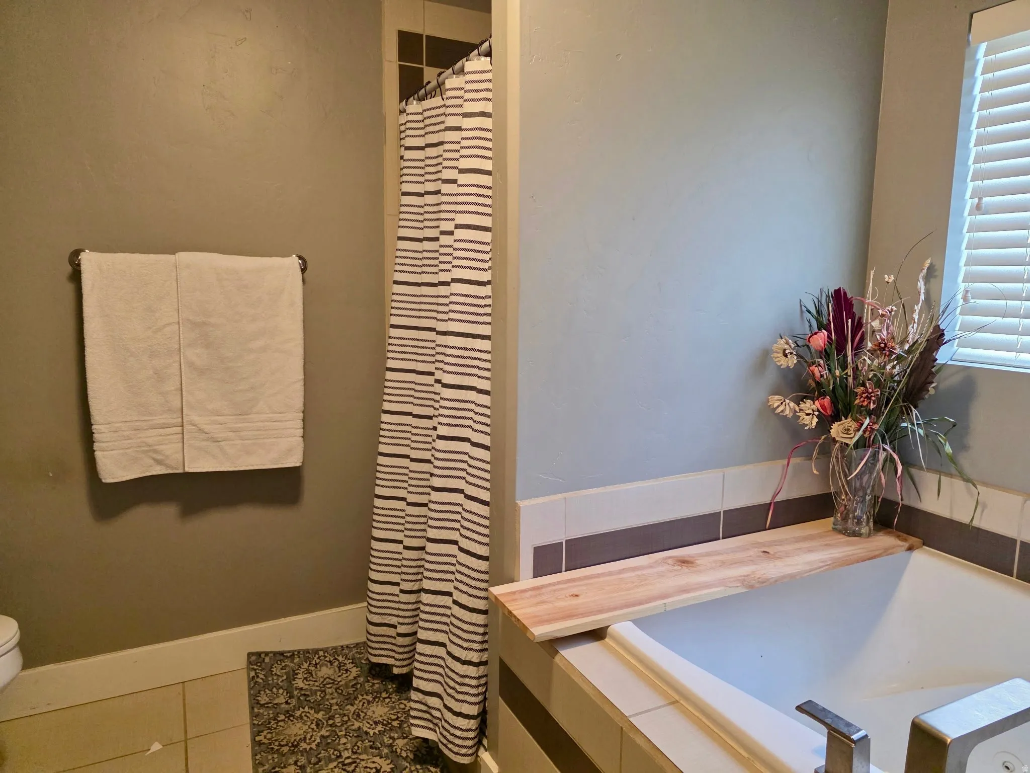 Full bathroom with a shower with curtain, tile patterned flooring, and a bath