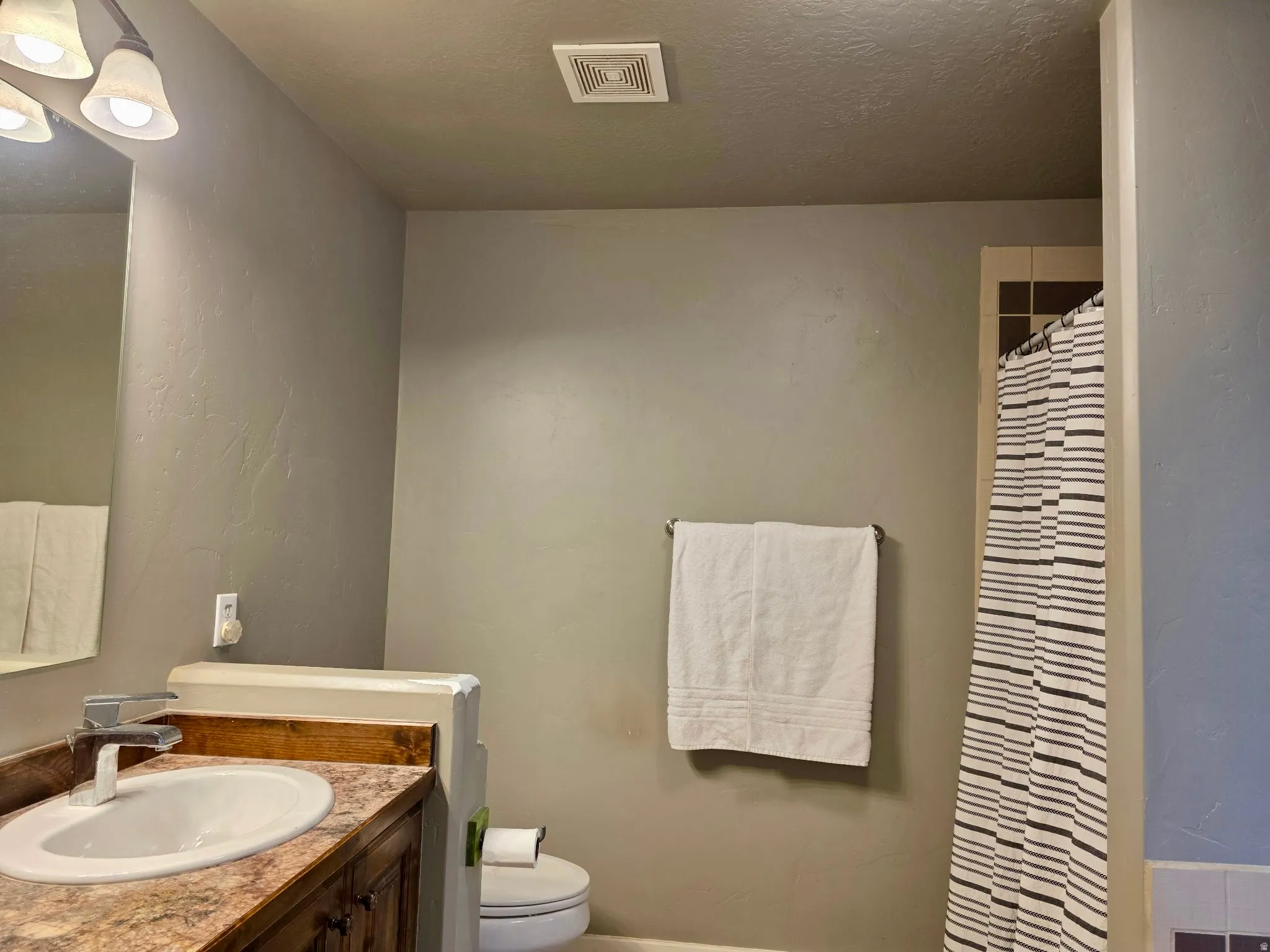 Primary bath featuring shower stall, separate soaker tub and vanity