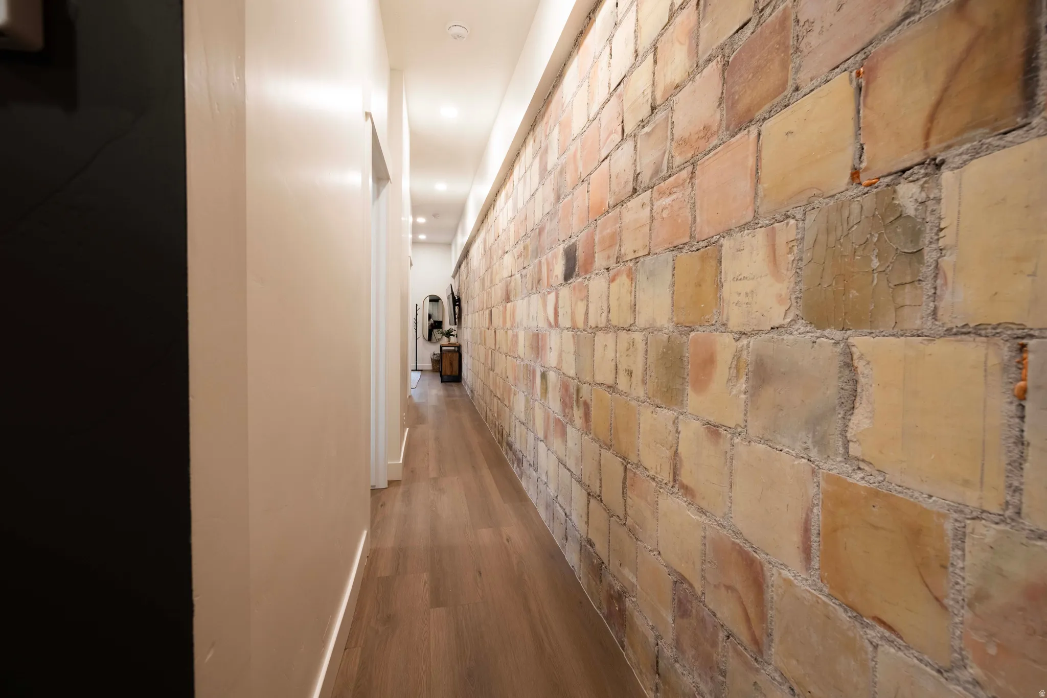 Apt. #4 Hallway with original rock accent wall