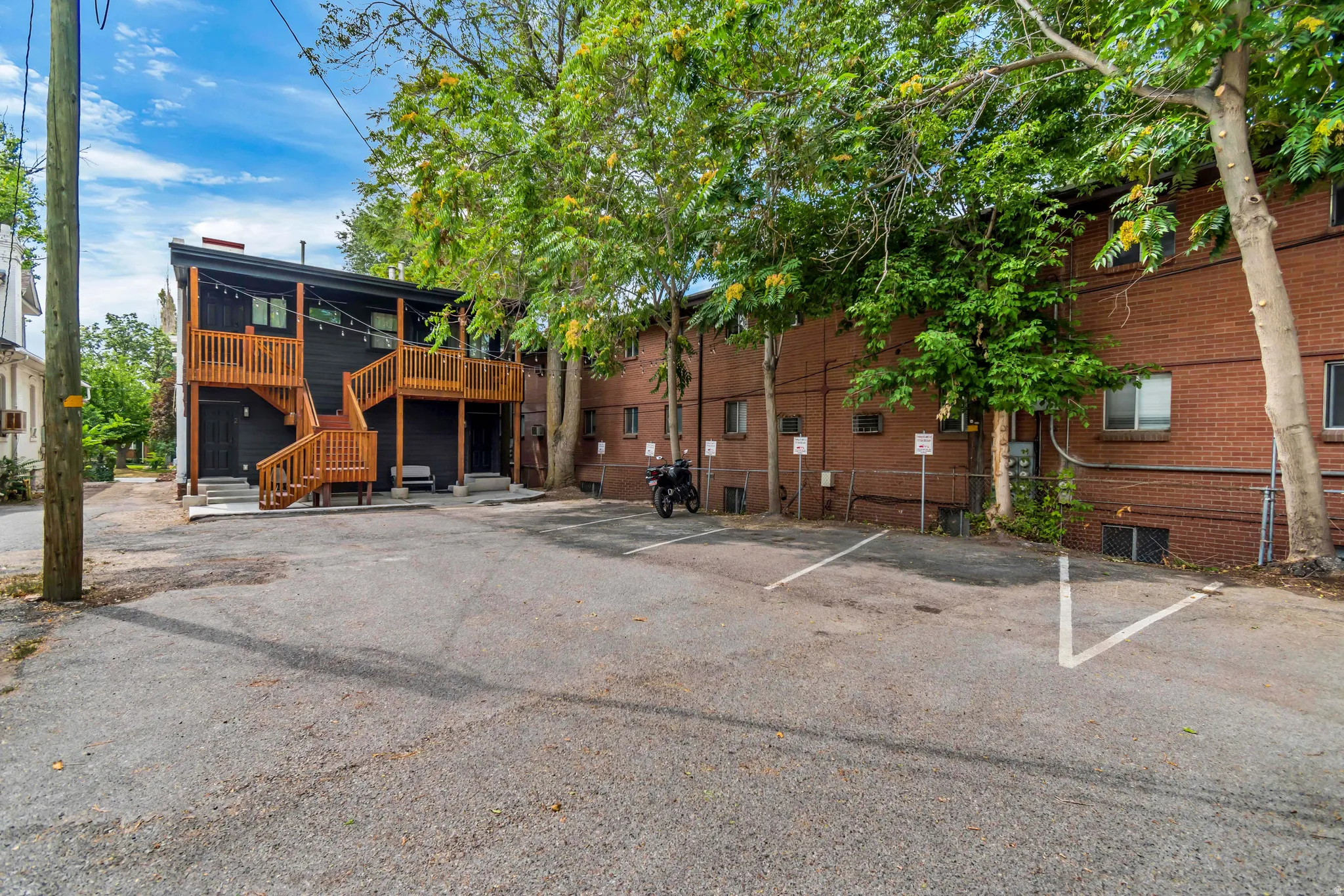 Back of property with dedicated paved parking
