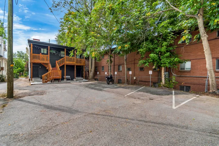 Back of property with dedicated paved parking