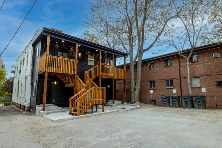 View of back decks, patios and parking lot