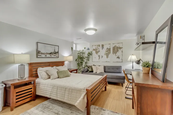 Apt. #5 Bedroom 2 featuring  laminate wood flooring