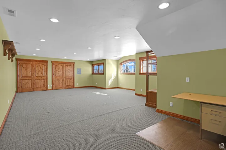 Below grade area featuring recessed lighting and carpet floors