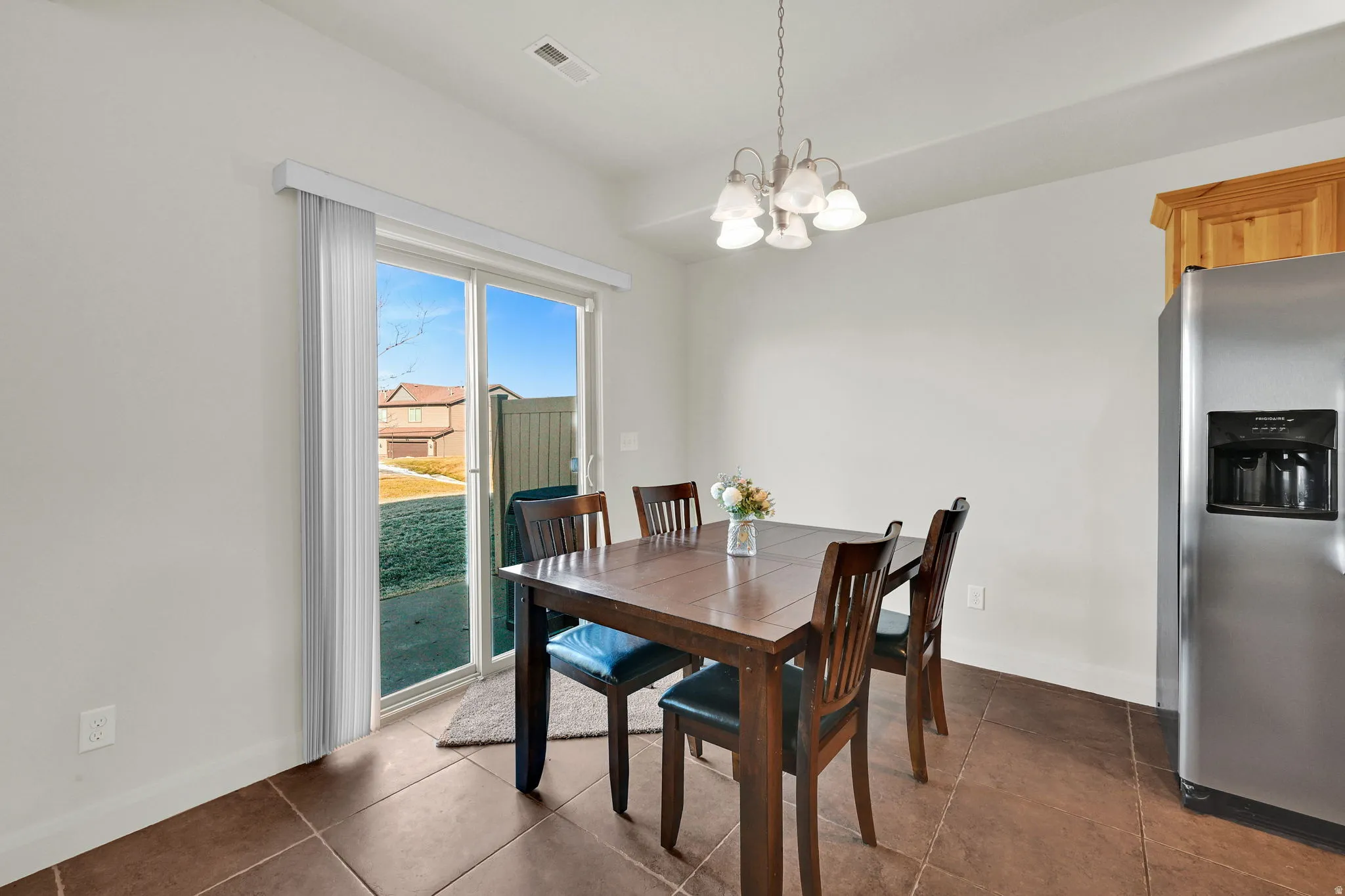 Dining space featuring suspended lighting and baseboards