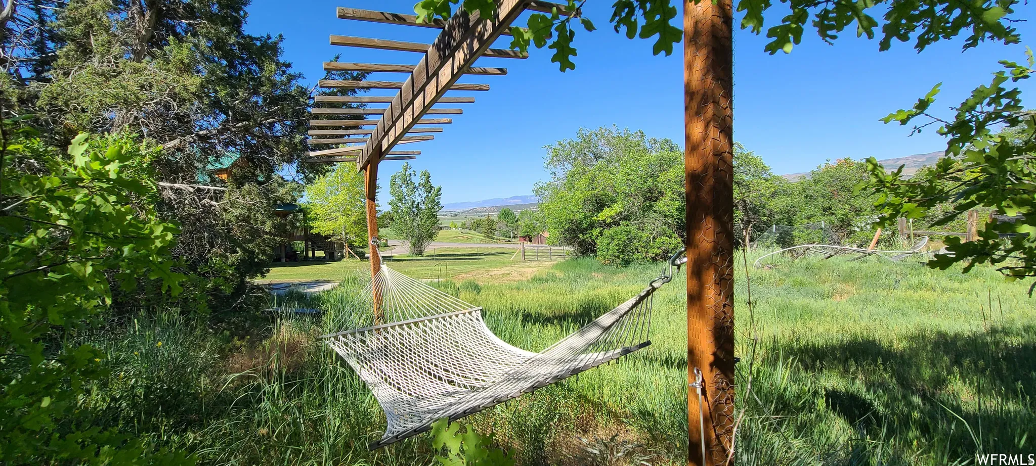 View of yard with a mountain view and a rural view