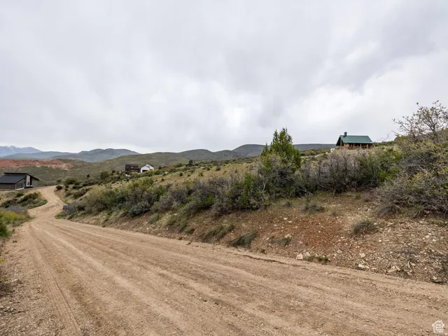 View of mountain backdrop with rural landscape