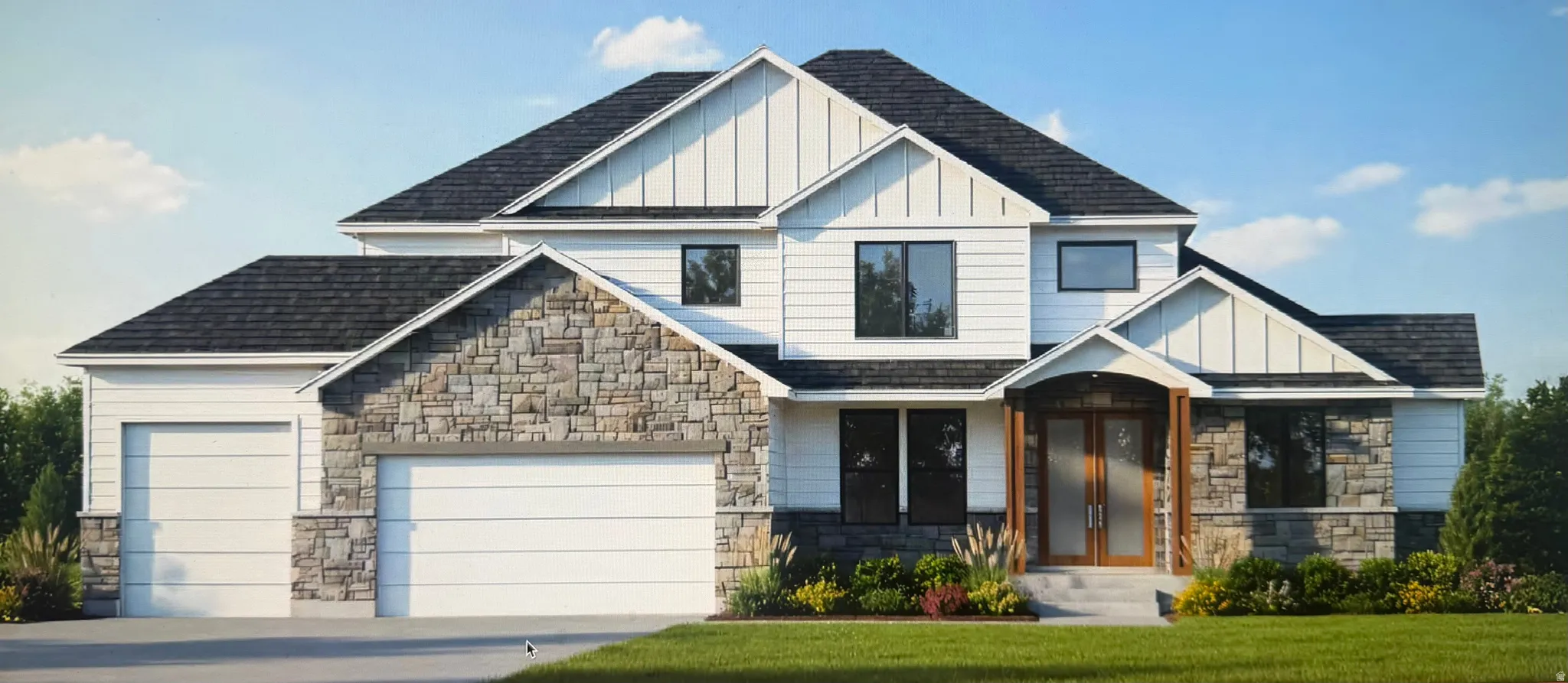 Craftsman-style house featuring stone siding, board and batten siding, concrete driveway, and an attached garage