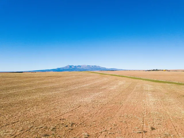 View of mountain backdrop featuring rural landscape