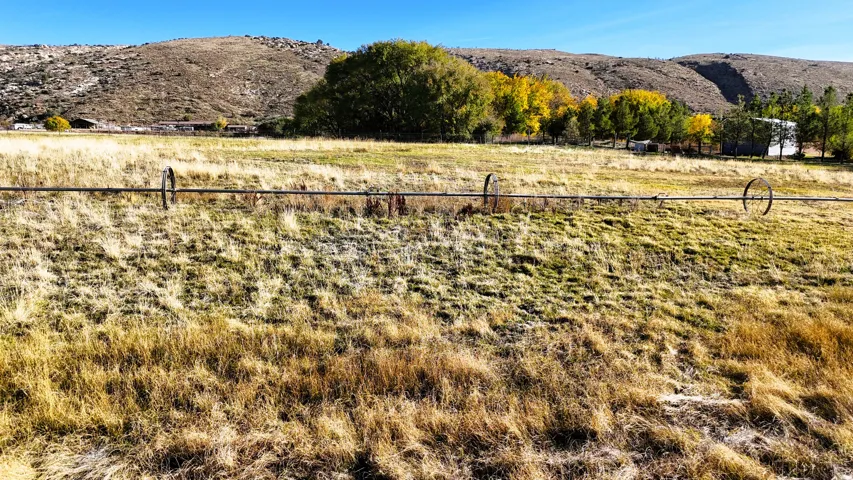 View of mountain backdrop with rural landscape