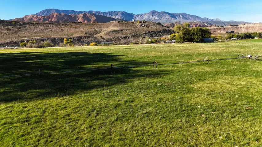 View of mountain backdrop featuring rural landscape