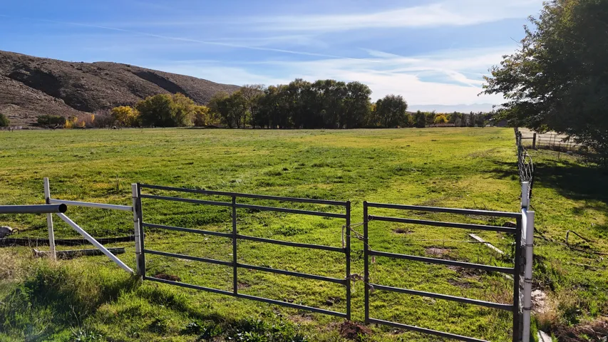 Gate featuring a rural view and a mountain view