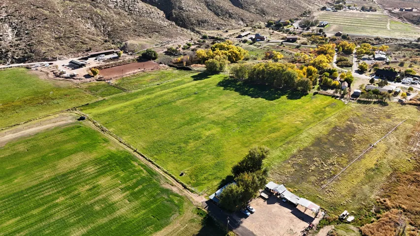 Aerial overview of property's location with rural landscape and farmland
