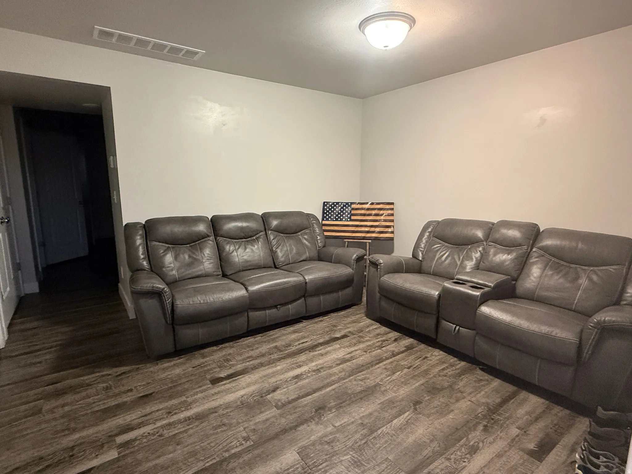 Living room featuring dark wood finished floors