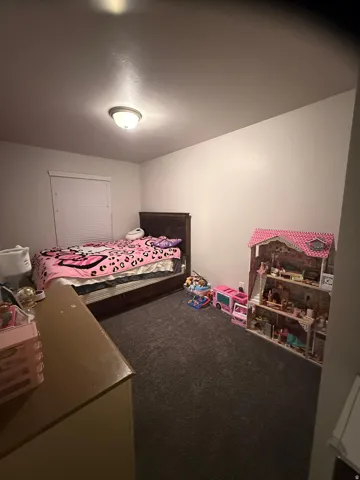 Bedroom featuring carpet