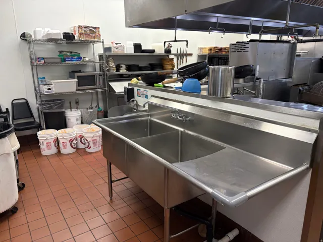 Kitchen with stainless steel microwave