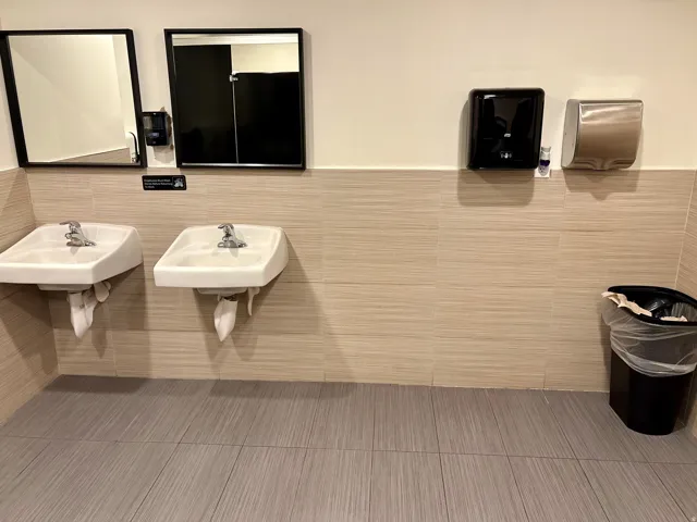 Bathroom with tile walls and wainscoting
