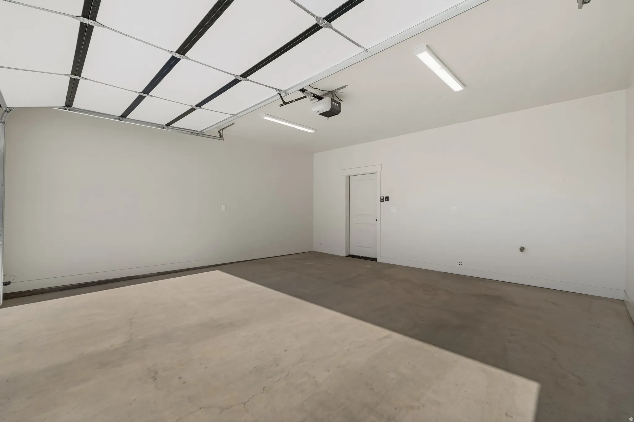 Garage featuring a garage door opener