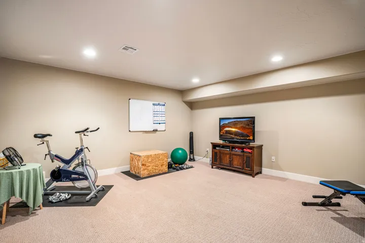 Workout area with carpet and recessed lighting