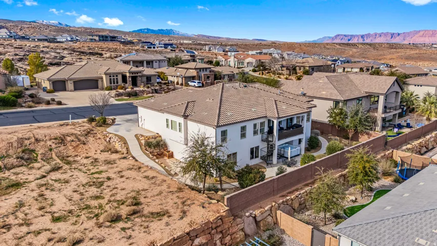 Aerial perspective of suburban area with a mountain backdrop