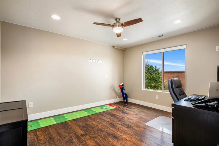 Office featuring dark wood finished floors, ceiling fan, and recessed lighting