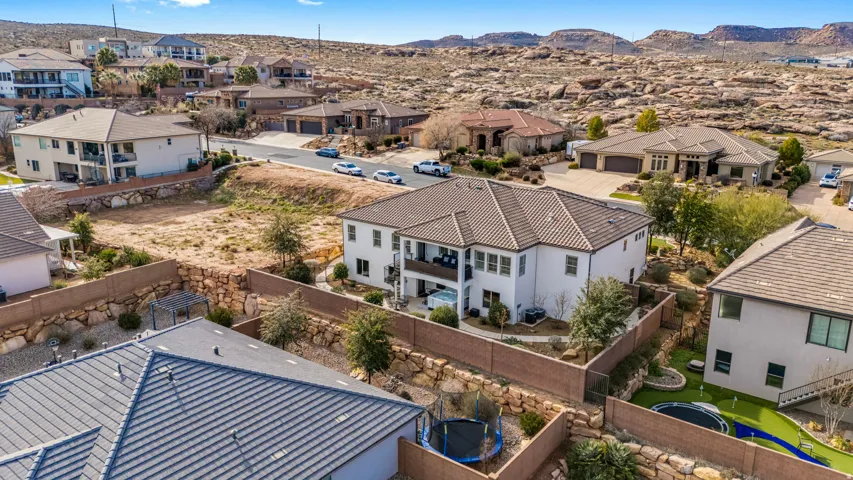 Aerial view of residential area featuring a mountain backdrop