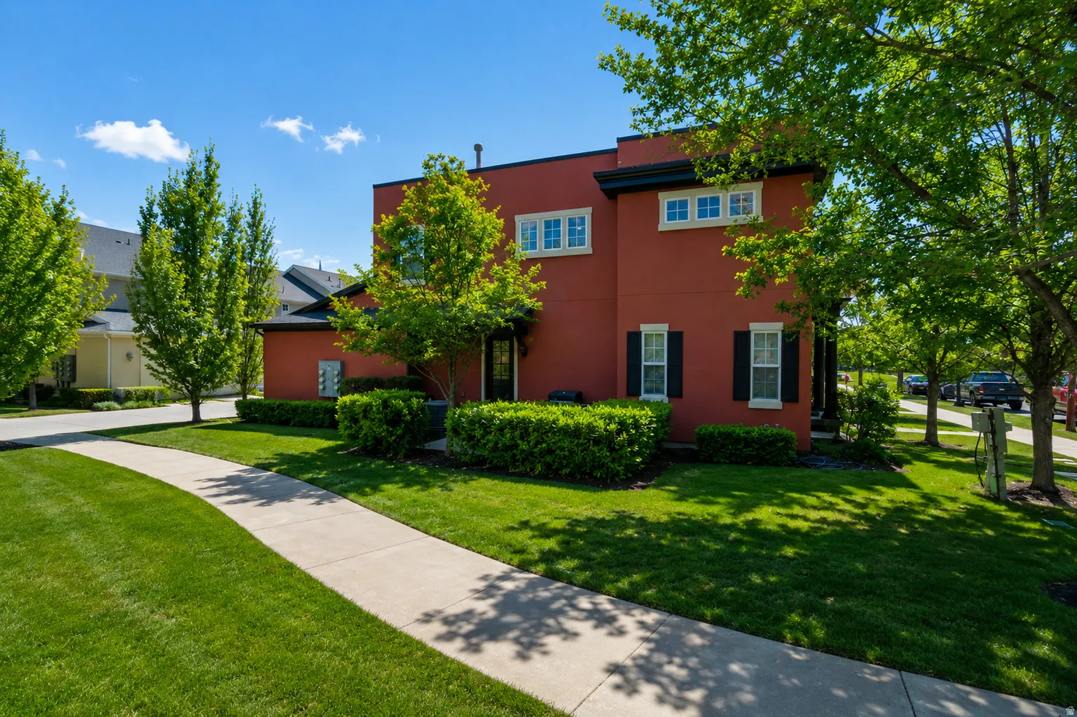 Red stucco exterior with contrasting black trim