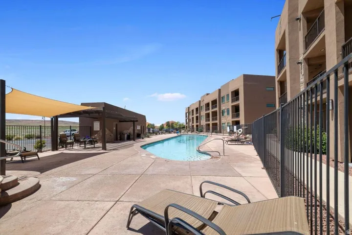 Community pool with a patio