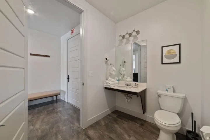 Half bathroom featuring toilet and vanity