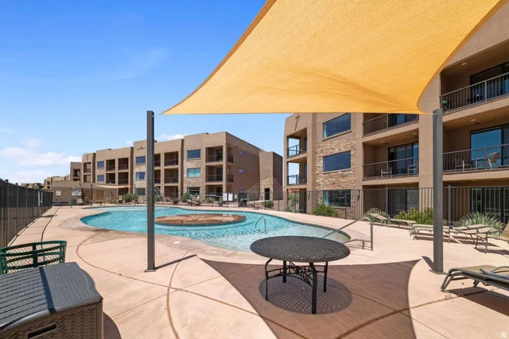 Community pool with a patio area