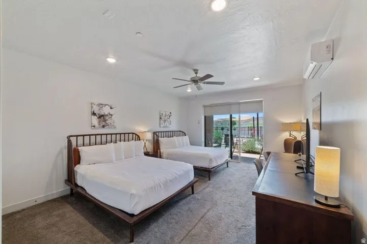 Carpeted bedroom featuring access to exterior, recessed lighting, and ceiling fan