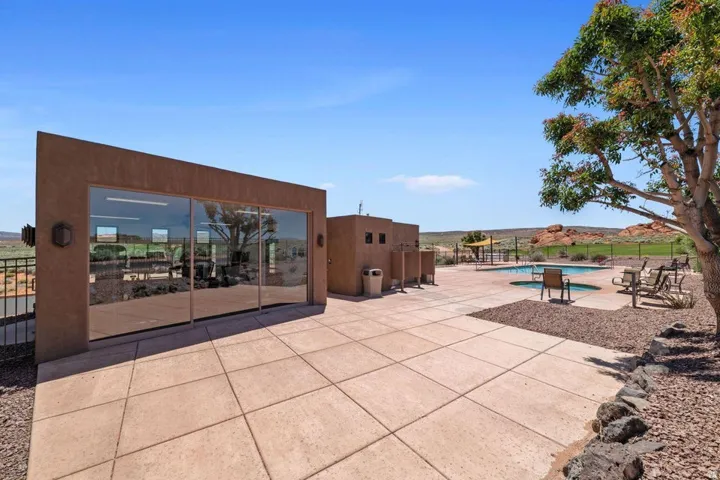 View of patio featuring a community pool